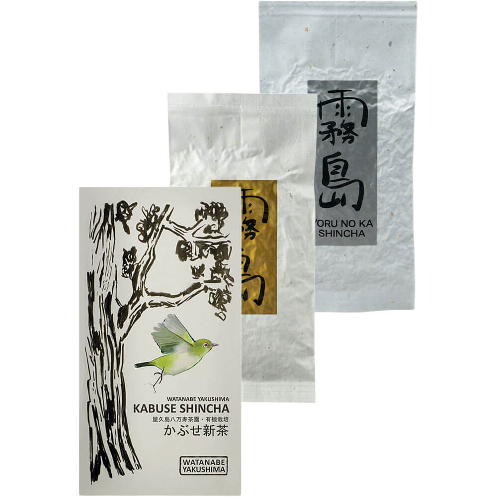 Drei edle japanische Shincha-Tees in stilvoller Präsentation: Watanabe Kabuse Shincha mit Vogelillustration, Kirishima Miumori Shincha in goldener Verpackung und Yoru no Ka Shincha in silberner Packung – alle aus der ersten Frühlingspflückung in Bio-Qualität.